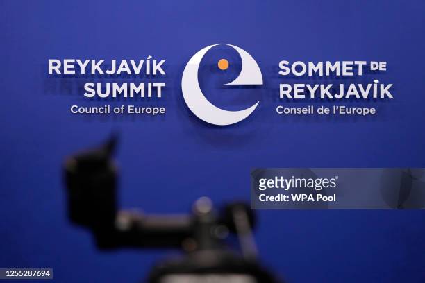 Television camera stands in front of a logo at the arrivals area of the Harpa concert hall during a Council of Europe summit on May 16, 2023 in...