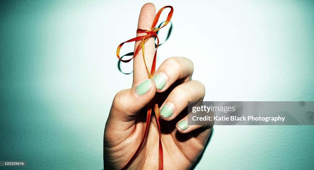 Reminder Ribbon Tied to Finger