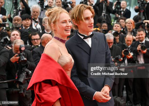 Uma Thurman and Levon Roan Thurman-Hawke at the "Jeanne du Barry" Screening & Opening Ceremony Red Carpet at the 76th Cannes Film Festival held at...