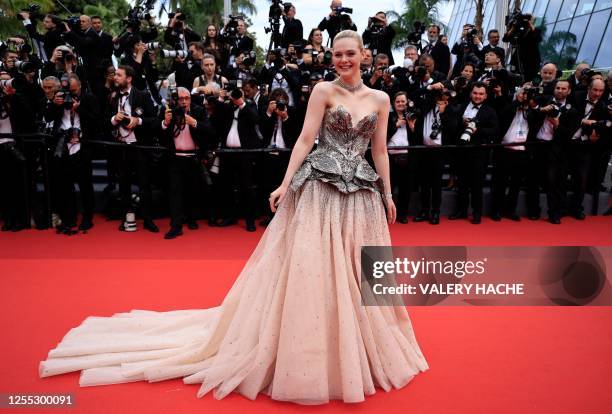 Actress Elle Fanning arrives for the opening ceremony and the screening of the film "Jeanne du Barry" during the 76th edition of the Cannes Film...