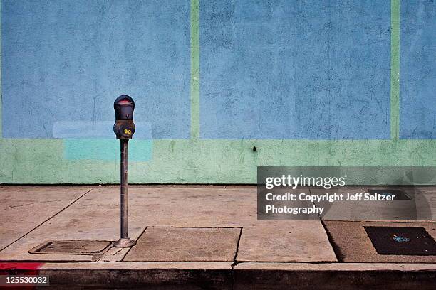 parking meter with blue wall - parking meter stock pictures, royalty-free photos & images