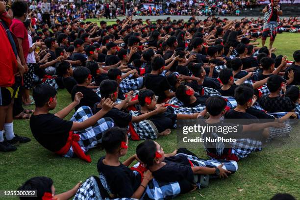 Balinese student dancers perform the Kecak dance during the National Education Day in Klungkung, Bali, Indonesia, May 16, 2023. About 1,000 students...