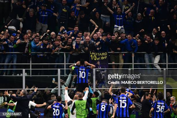 Inter Milan's Argentinian forward Lautaro Martinez celebrates after opening the scoring during the UEFA Champions League semi-final second leg...