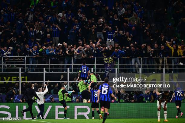 Inter Milan's Argentinian forward Lautaro Martinez celebrates after opening the scoring during the UEFA Champions League semi-final second leg...