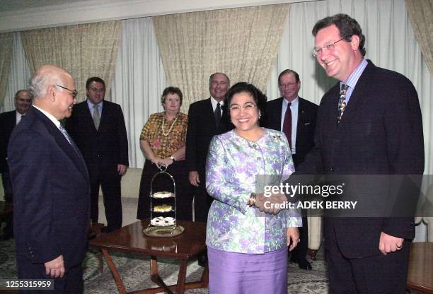 Indonesian President Megawati Sukarnoputri welcomes Australian Foreign Minister Alexander Downer as Indonesian Top Economy Minister, Dorodjatun...