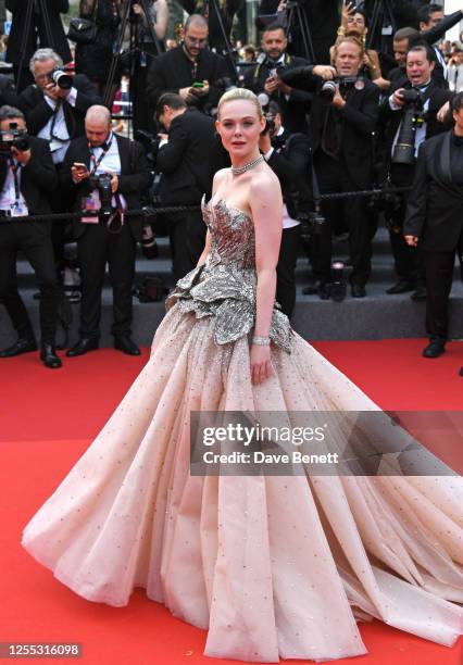 Elle Fanning attends the "Jeanne du Barry" screening & opening ceremony red carpet at the 76th Annual Cannes Film Festival at Palais des Festivals on...