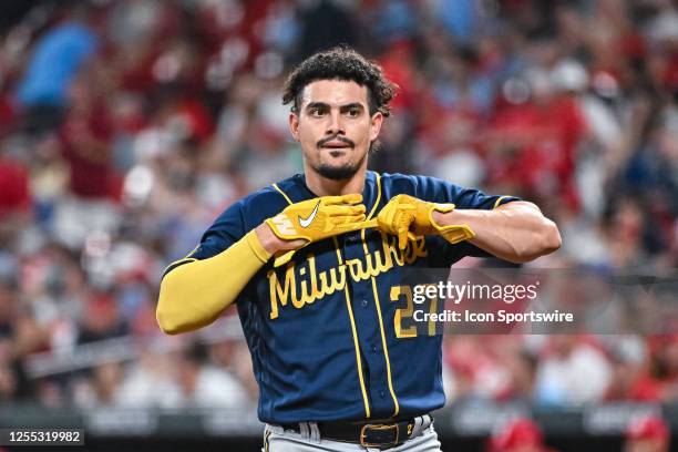 Milwaukee Brewers shortstop Willy Adames shows his disgust after being called out on strikes while taking off his batting gloves during a game...