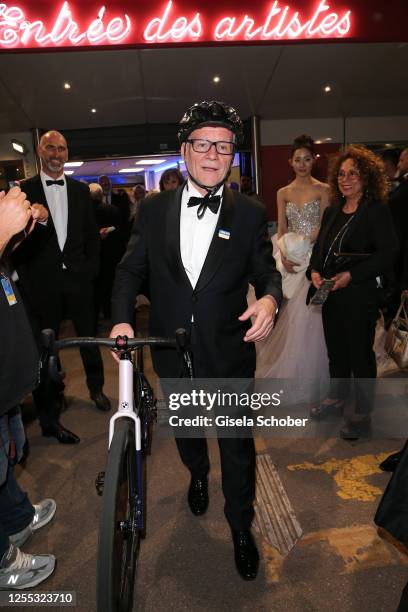 Thierry Fremaux with his bicycle leaves the "Jeanne du Barry" the screening and premiere at the 76th annual Cannes film festival at Palais des...