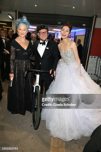 Helen Mirren, Thierry Fremaux, Qian Hui leaves the "Jeanne du Barry" the screening and premiere at the 76th annual Cannes film festival at Palais des...