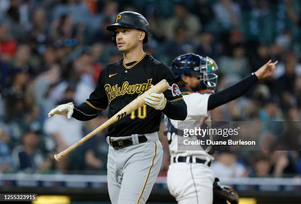 Bryan Reynolds of the Pittsburgh Pirates walks back to the dugout after striking out with catcher Eric Haase of the Detroit Tigers behind the plate...