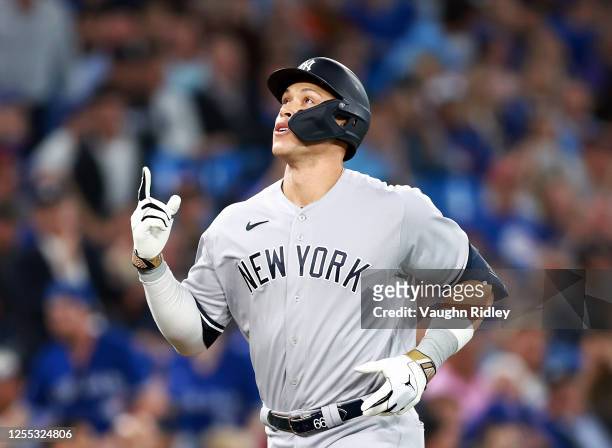 Aaron Judge of the New York Yankees celebrates after hitting a home run in the eighth inning against the Toronto Blue Jays at Rogers Centre on May...