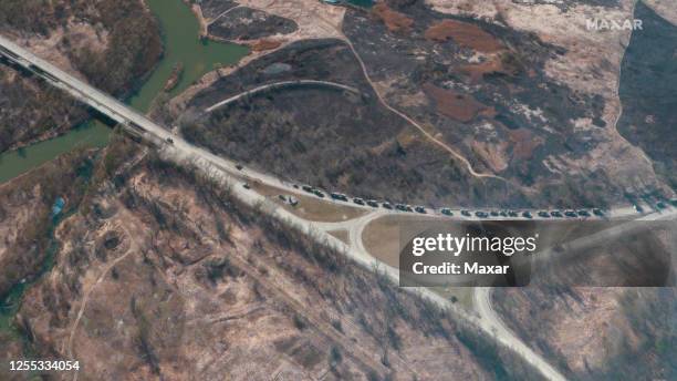 Maxar satellite imagery of a convoy or Russian troops headed towards the Ukranian Capital of Kyiv. Please use: Satellite image 2023 Maxar...