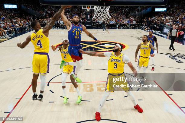 Denver, CO, Tuesday, May 16, 2023 - Denver Nuggets forward Bruce Brown swoops in for a slam dunk in the second half as Lakers players look on in game...