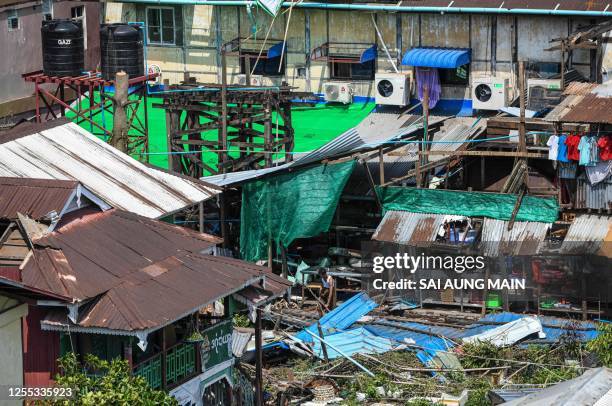 Man checks his damaged house by cyclone Mocha in Sittwe in Myanmar's Rakhine state on May 17, 2023. The death toll in cyclone-hit Myanmar rose to at...