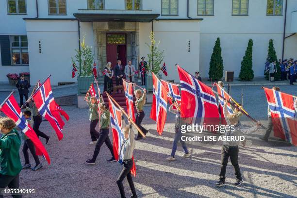 Norway's Crown Princess Mette-Marit, Prince Sverre Magnus and Crown Prince Haakon greet and watch the children's parade during the May 17th...