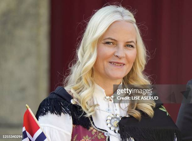 Norway's Crown Princess Mette-Marit smiles as she attends the children's parade during the May 17th celebrations at the royal residence Skaugum, in...