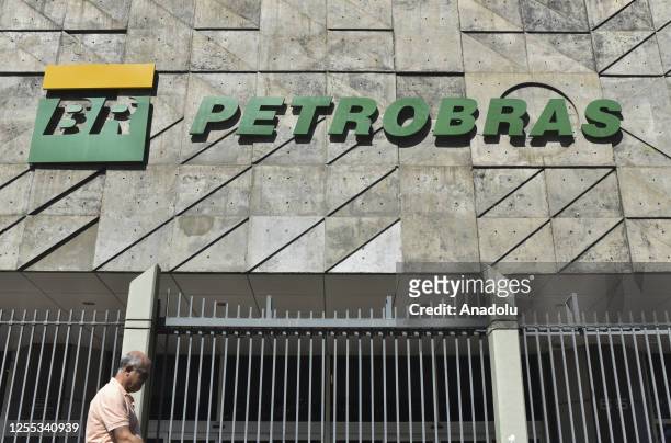 People walk past in front of the Petrobras headquarters building at downtown area in Rio de Janeiro, Brazil on May 16, 2023. The president of...