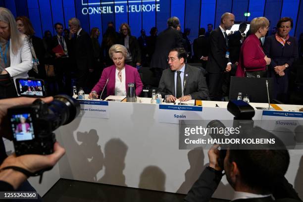 President of the European Commission Ursula von der Leyen and Spain's Foreign Minister Jose Manuel Albares Bueno take seat to attend the closing...