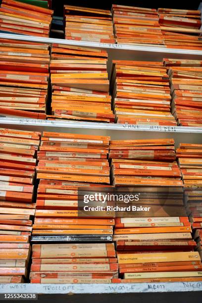 Penguin Classics piled up on bookshelves inside Hurlingham Books in Putney, west London, on 16th May 2023, in London, England.