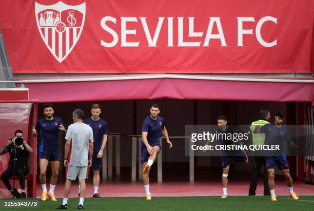 Sevilla's Brazilian defender Alex Telles, Sevilla's Croatian midfielder Ivan Rakitic, Sevilla's Spanish forward Rafa Mir, Sevilla's Spanish...