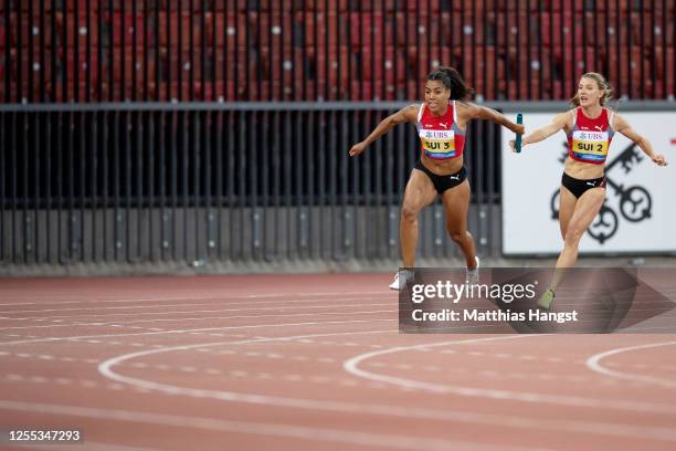 Mujinga Kambundji of Switzerland competes in front of her team mate Ajla del Ponte at the 3x100m relay competition during the Weltklasse Zurich...