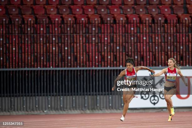 Mujinga Kambundji of Switzerland competes in front of her team mate Ajla del Ponte at the 3x100m relay competition during the Weltklasse Zurich...