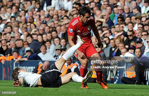 Jose Enrique of Liverpool in action with Luka Modric of Tottenham Hotspur during the Barclays Premier League match between Tottenham Hotspur and...