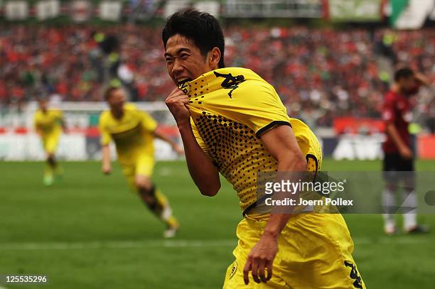 Shinji Kagawa of Dortmund celebrates after scoring his team's first goal during the Bundesliga match between Hanover 96 and Borussia Dortmund at AWD...