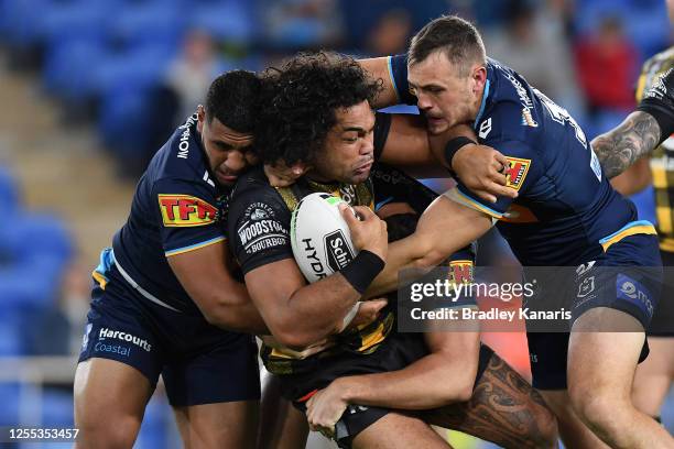 Adam Blair of the Warriors is tackled during the round nine NRL match between the Gold Coast Titans and the New Zealand Warriors at Cbus Super...