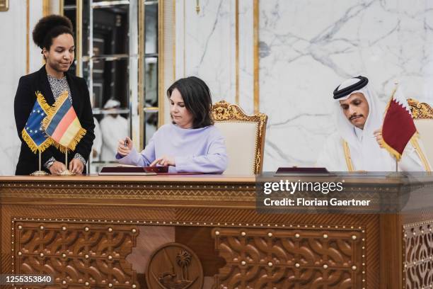 Annalena Baerbock, German Foreign Minister, and Mohammed bin Abdulrahman bin Jassim Al Thani, Prime Minister and Foreign Minister of Qatar, sign a...