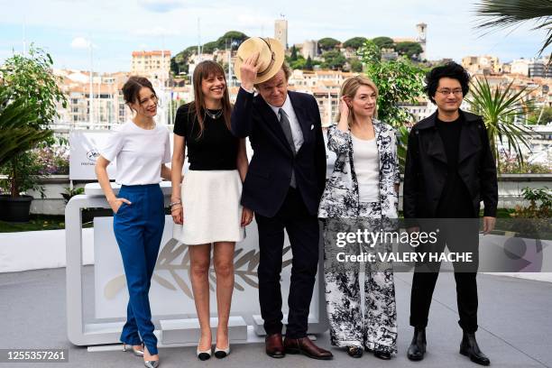 Actor and President of the Un Certain Regard jury John C. Reilly poses with members of the jury German actress Paula Beer, French film director Alice...