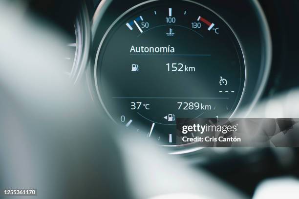 car fuel, coolant gauge and outdoors temperature panel - kilometer stock pictures, royalty-free photos & images