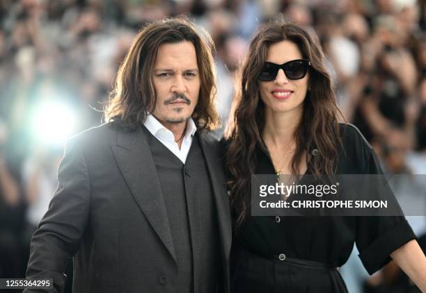 Actor Johnny Depp and French actress and director Maiwenn pose during a photocall for the film "Jeanne Du Barry" at the 76th edition of the Cannes...
