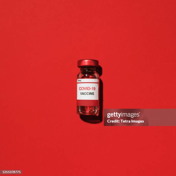 studio shot of vial with covid-19 vaccine - covid 19 vaccine vial stock pictures, royalty-free photos & images