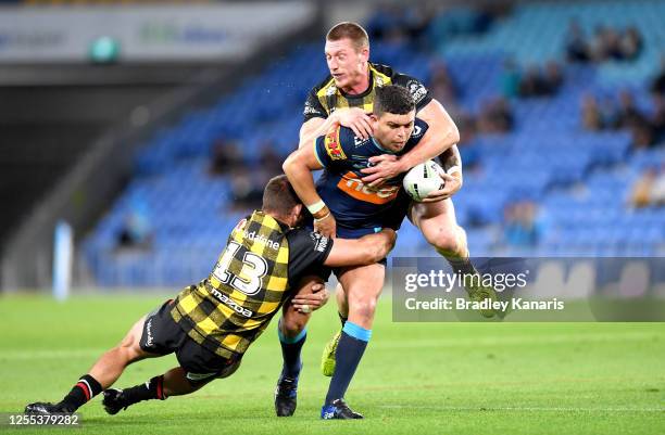 Ashley Taylor of the Titans takes on the defence during the round nine NRL match between the Gold Coast Titans and the New Zealand Warriors at Cbus...