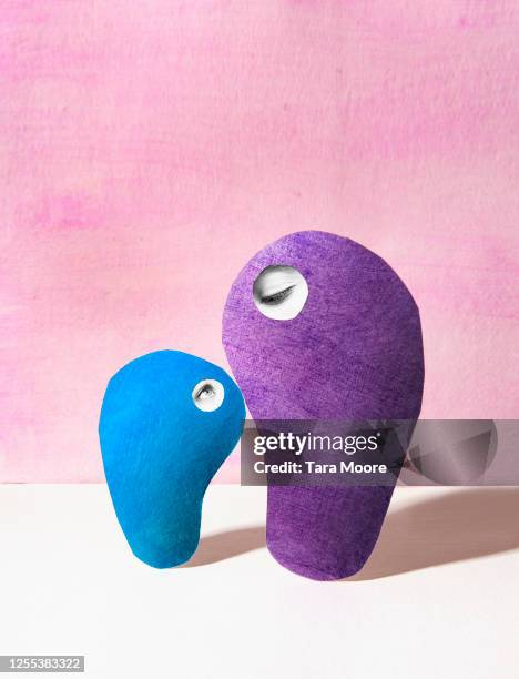 two unusual shapes with eyes - big hug stock pictures, royalty-free photos & images