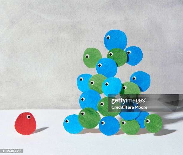 cycles with eyes looking at a loner - anti atom stock pictures, royalty-free photos & images