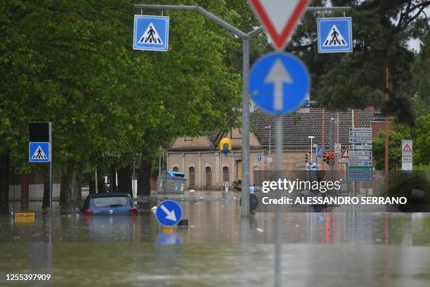 Flooded street is pictured in Cesena on May 17, 2023 after heavy rains caused major floodings in central Italy. Trains were stopped and schools were...