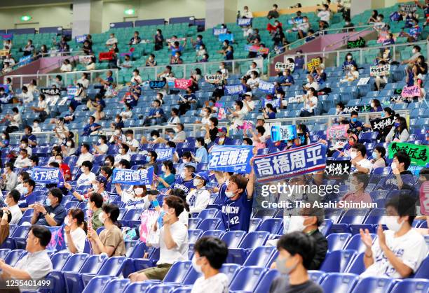 Fans cheer with keeping social distances during the game between Hiroshima Toyo Carp and Chunichi Dragons at the Nagoya Dome on July 10, 2020 in...