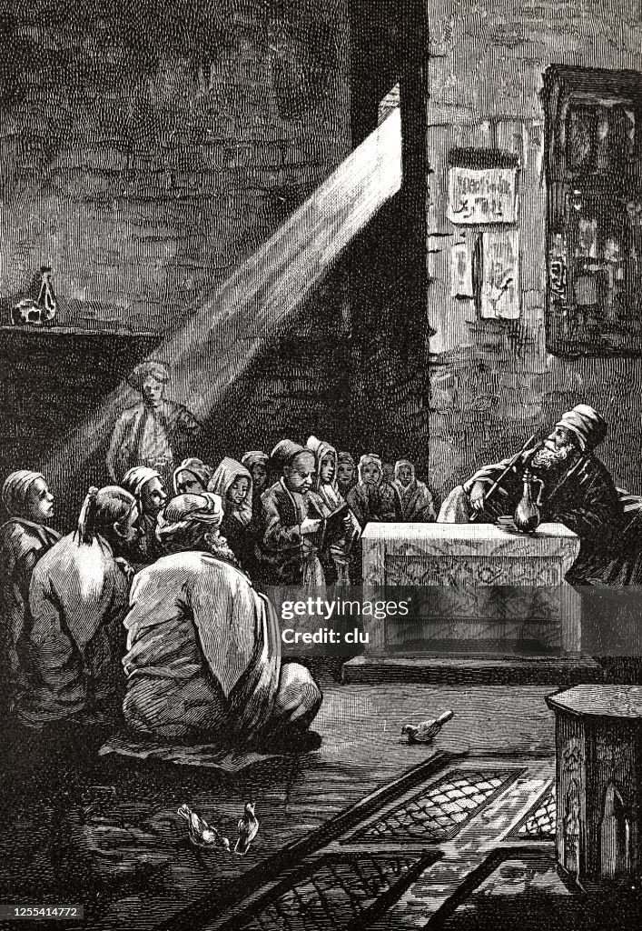 School in Morocco, teacher surrounded by students, indoor