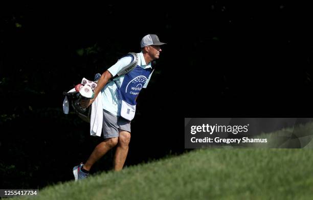 Caddie Jim "Bones" Mackay carries the bag of Matthew Fitzpatrick of England during the second round of the Workday Charity Open on July 10, 2020 at...