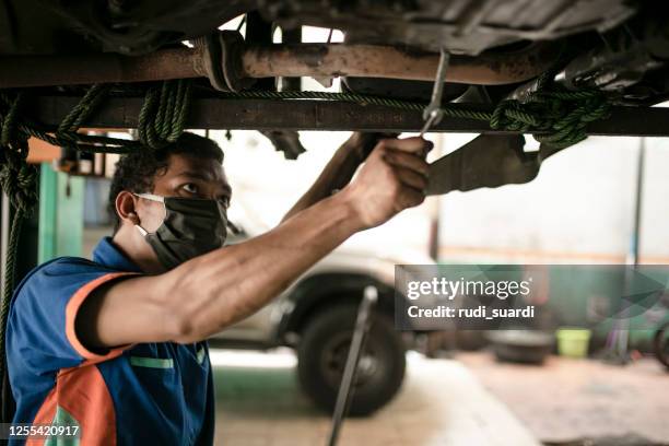 technician automotive checking car in the garage - car dealership covid stock pictures, royalty-free photos & images