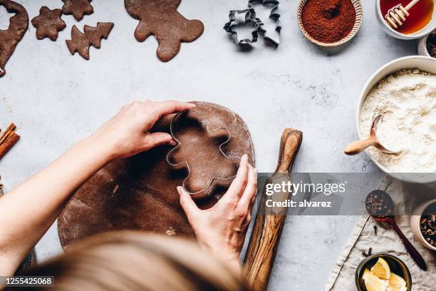 woman preparing gingerbread cookies - baking overhead stock pictures, royalty-free photos & images