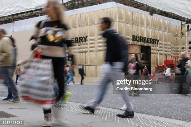 Shoppers pass renovation works at the Burberry Group Plc store on New Bond Street in London, UK, on Wednesday, May 17, 2023. Chinese demand probably...