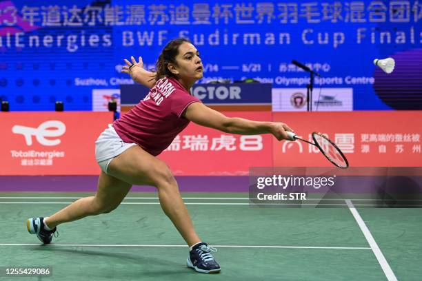 Freya Redfearn of England hits a return against Qi Xuefei of France during their women's singles match at the Sudirman Cup Finals 2023 world...