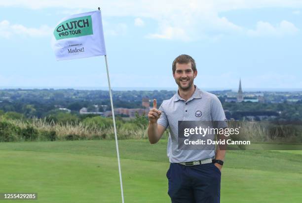 Bradley Neil of Scotland celebrates his tee shot for a hole in one on the eighth hole during the Clutch Pro Tour Major on The Downs Course at...