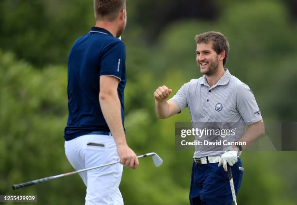 Bradley Neil of Scotland celebrates his tee shot for a hole in one on the eighth hole during the Clutch Pro Tour Major on The Downs Course at...