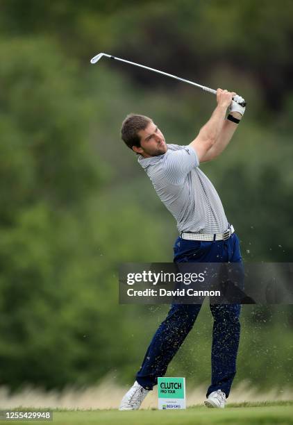 Bradley Neil of Scotland plays his tee shot for a hole in one on the eighth hole during the Clutch Pro Tour Major on The Downs Course at Goodwood...