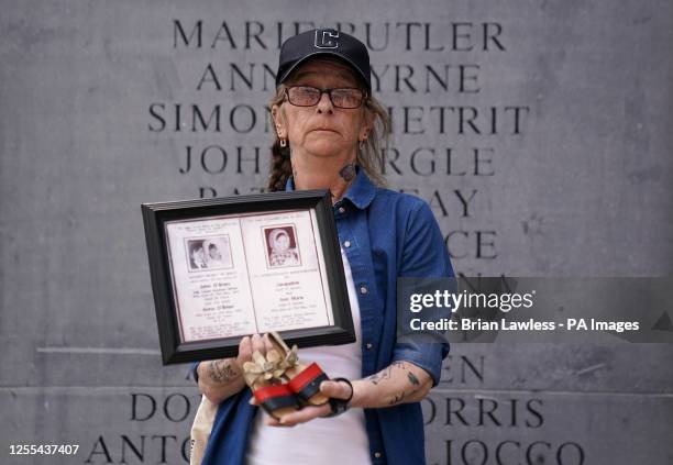 Cathy Ellis holds a pair of shoes which belonged to her niece 17-month-old Jacqueline O'Brien who was killed in the Dublin-Monaghan bombings ahead of...