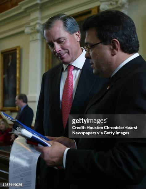 Lieutenant Governor David Dewhurst speaks with Santo Santoro a Senator for Queensland, Australia who was in the United States to help foster...